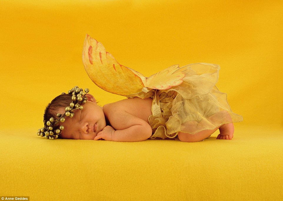 Jarrod, newborn, from Auckland, looks ethereal as he snoozes on the yellow set donning fairy wings and a tutu in 1997